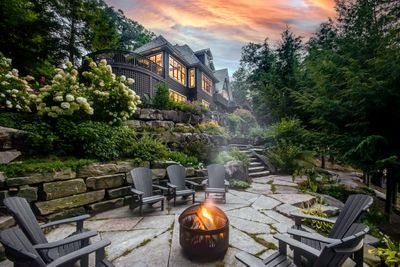 Muskoka estate terrace and firepit at sunset
