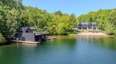 Muskoka waterfront estate and boathouse viewed from the lake
