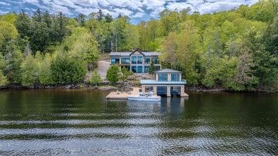 Muskoka waterfront residence and boathouse viewed across the lake